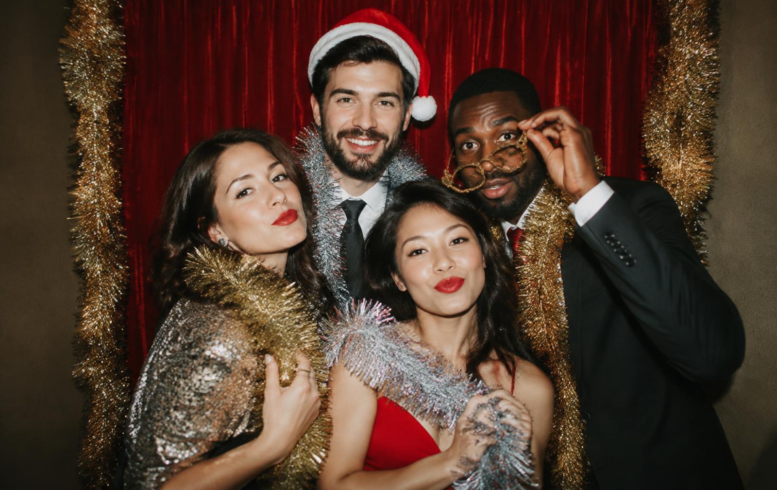 Christmas party guests in a photo booth