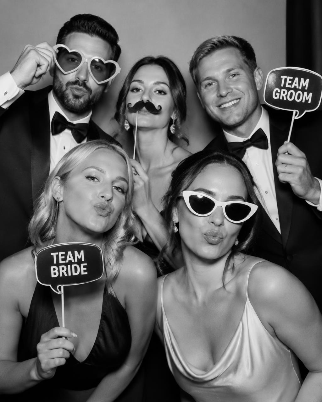 Wedding guests posing with props